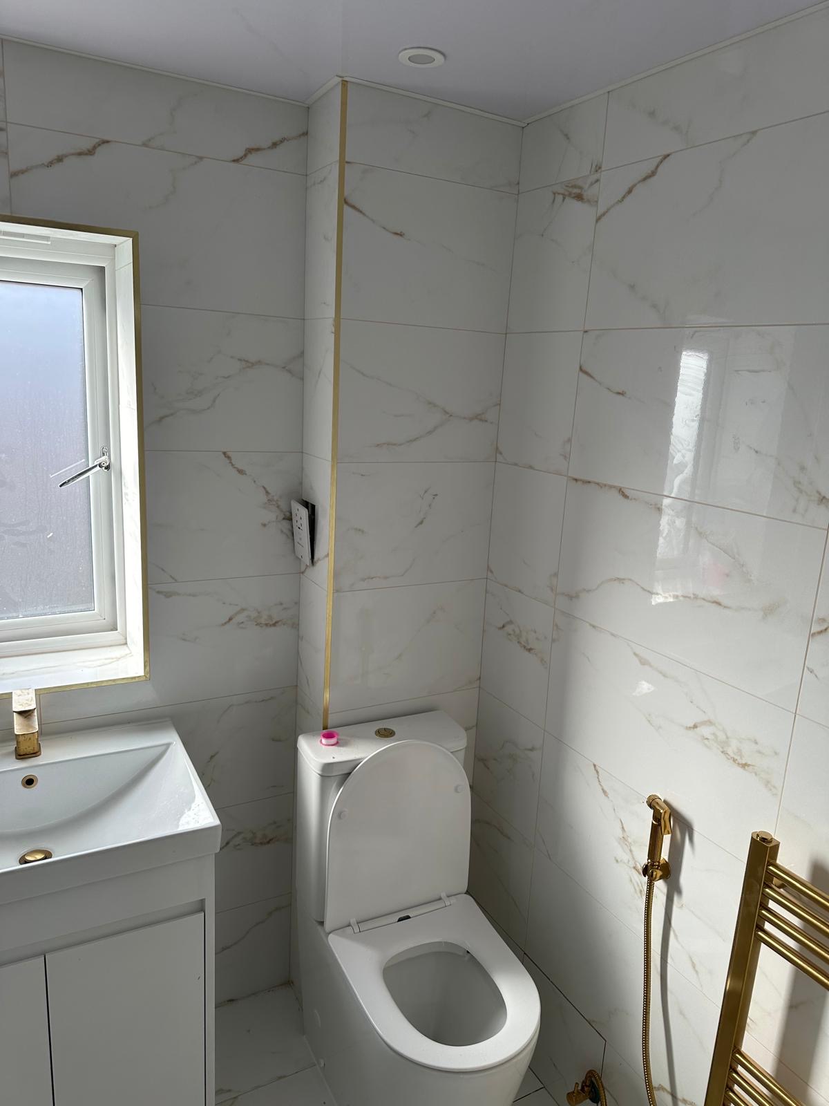 Luxury bathroom installation with marble tiling in Birmingham